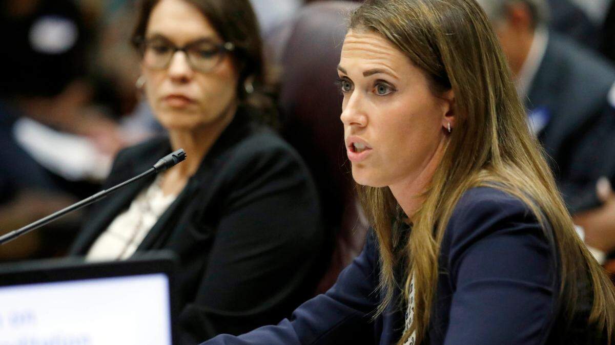 FILE - Paula Vanderford, chief accountability officer for the Mississippi Department of Education, left, listens to Erin Meyer, a special attorney general assigned to the department, presents a summary on why the state should initiate a takeover process of the Jackson Public Schools to members of the Commission on School Accreditation in Jackson, Miss., Wednesday, Sept. 13, 2017. On Thursday, July 21, 2022, the Mississippi Board of Education voted to update a 1990 internal policy that prohibited anyone other than law enforcement from carrying guns on public school campuses. (AP Photo/Rogelio V. Solis, File)