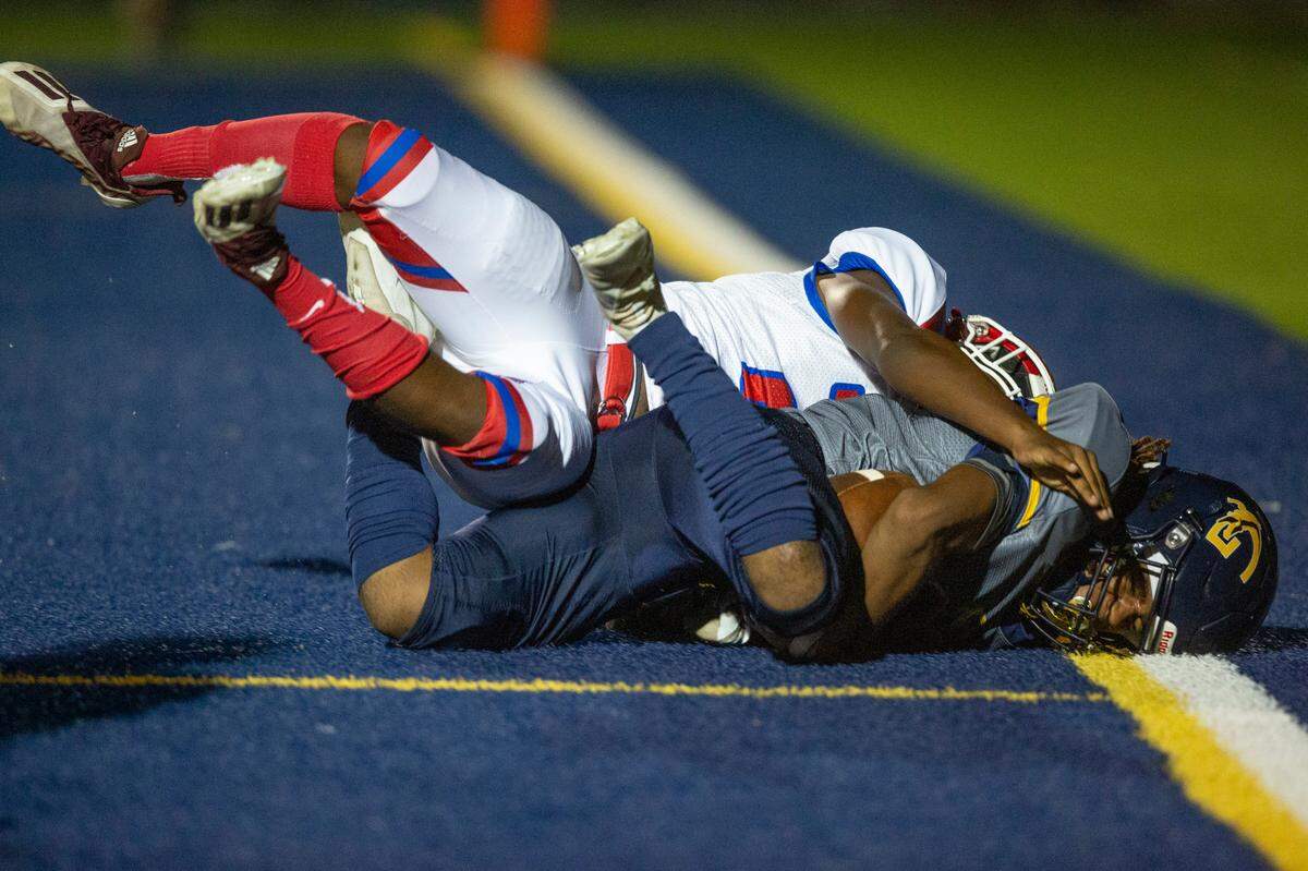 Gautier’s Kainen Rush gets tackled by Pascagoula as he scores a touchdown against Pascagoula at Gautier High School in Gautier on Friday, Sept. 2, 2022.