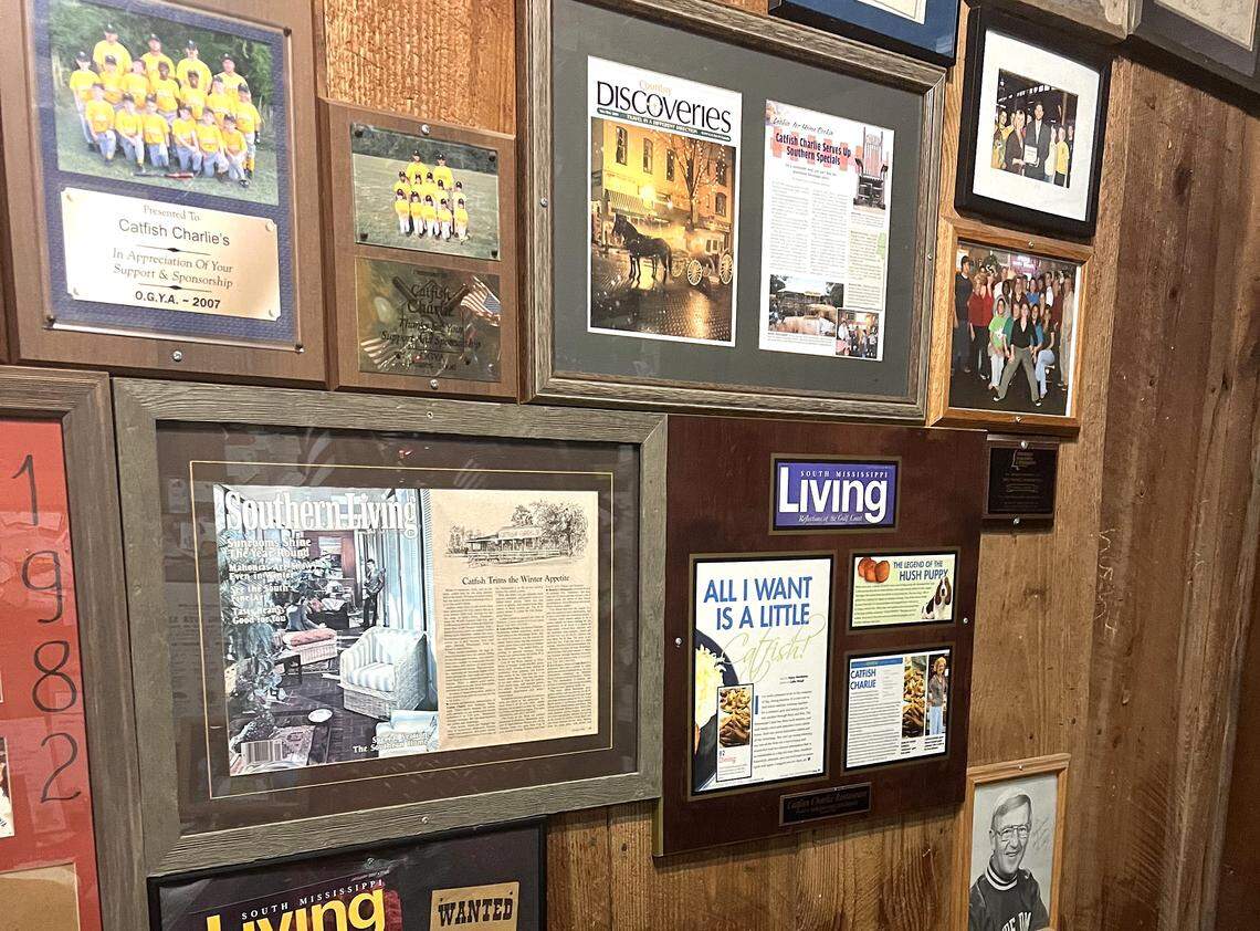 Awards and articles about Catfish Charlie hang on the wall of the Gulfport restaurant, along with license plates and other memorabilia.