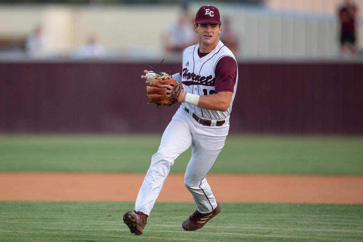 East Central’s TJ Dunsford prepares to throw a pass to first base in the 5A South State championship game at East Central High School in Hurley on Tuesday, May 23, 2023.