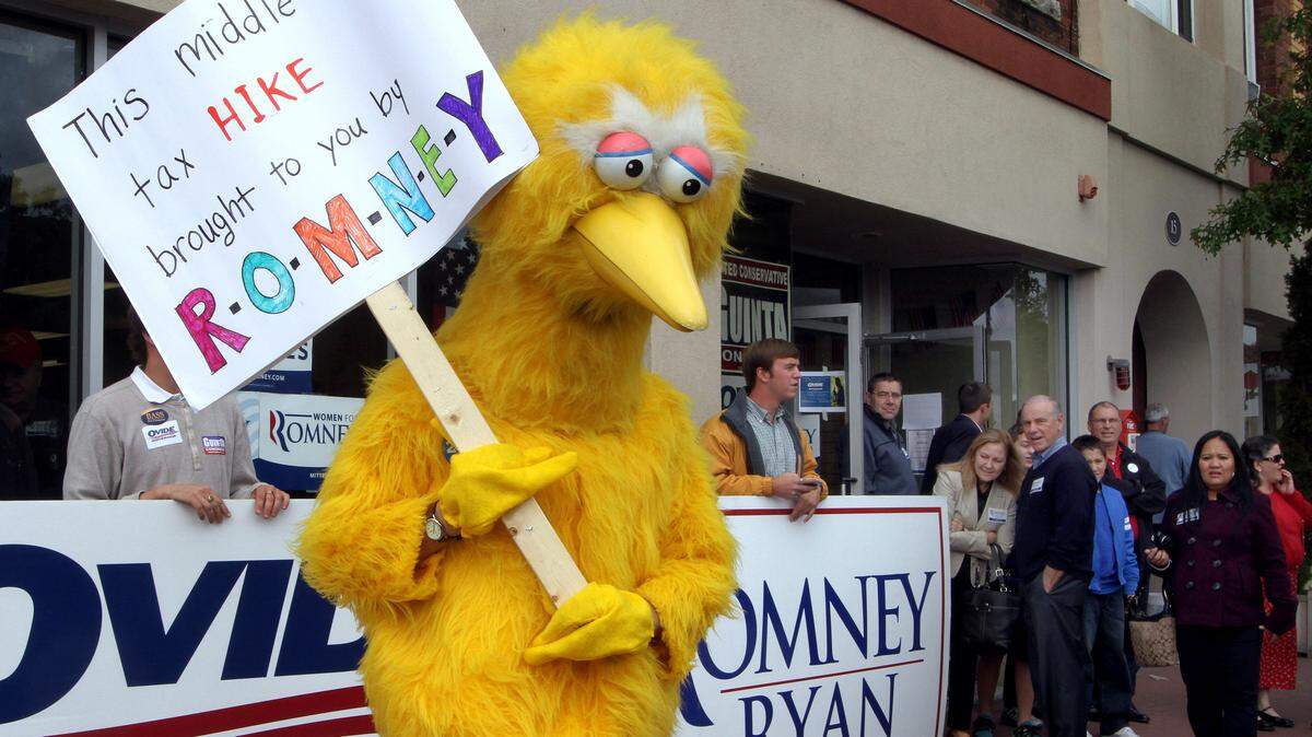 JIM COLE/ASSOCIATED PRESS 
 A person dressed up as Big Bird holds a sign against Republican presidential candidate, former Massachusetts Gov. Mitt Romney outside the Romney headquarters in 2012 in Derry, N.H.