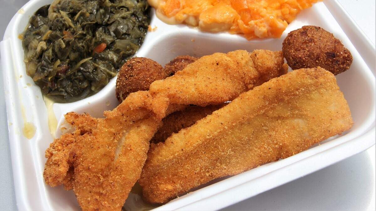 Fried fish, greens, hush puppies and mac and cheese.