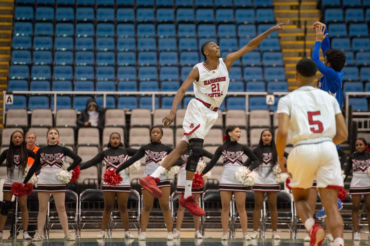 Harrison Central forward Sam Murray defends the ball from Pass Christian during Hoopsfest at the Mississippi Coast Coliseum in Biloxi on Saturday, Jan. 29, 2022.
