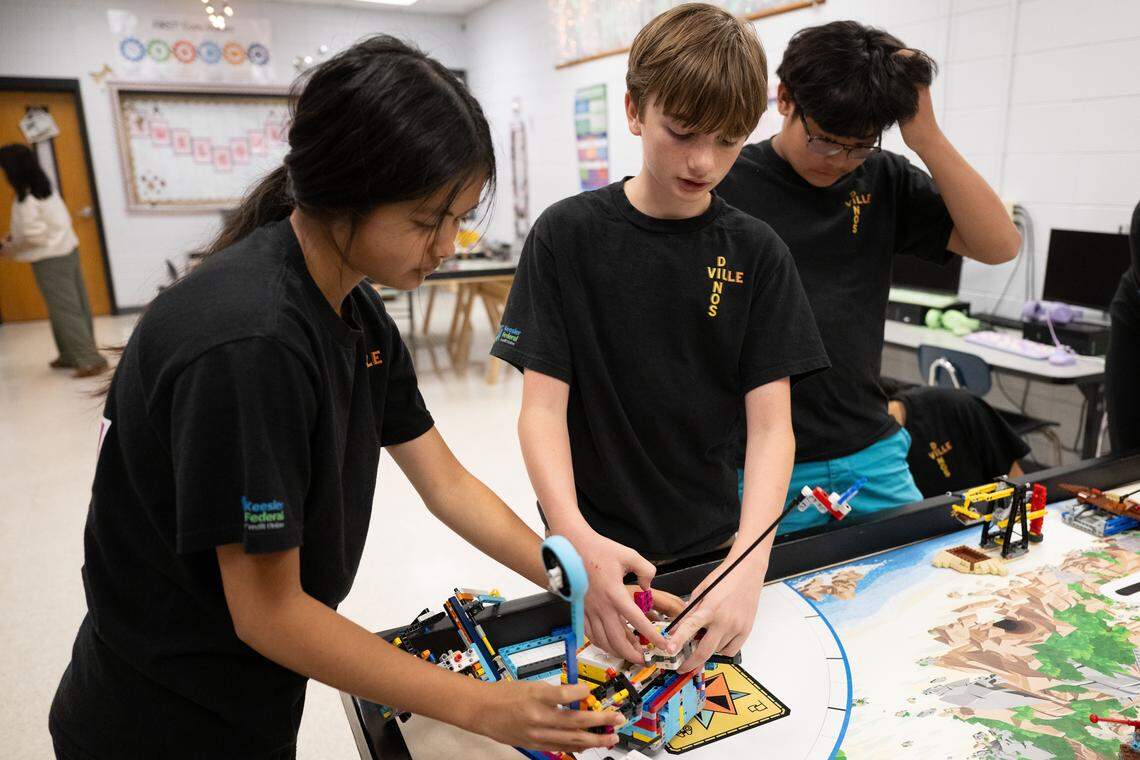 Iyla Lurix, left, and Baer Densing, right, prepare their robot at D’Iberville Middle School on Wednesday, April 15, 2026.