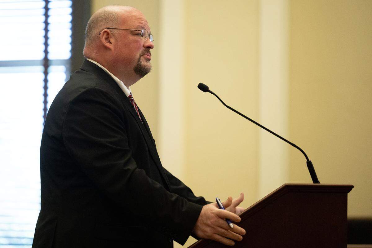 Hancock County Assistant District Attorney Jeremy Necaise speaks at the podium during a motion hearing at Hancock County Circuit Court on Oct. 21.