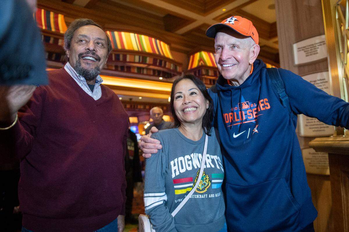 Jim McIngvale, better known as ‘Mattress Mack’, poses for photos with fans as he walks into the Beau Rivage Casino in Biloxi to make a $500,000 bet on the winner of the NCAA Men’s Basketball Tournament on Tuesday, Nov. 15, 2022.