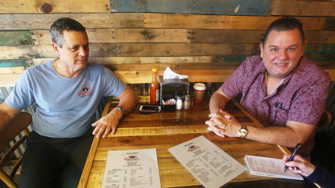Marlen Babin, left, and Mike Alise, friends since high school, have opened Parrain’s Jambalaya Kitchen in downtown Biloxi.