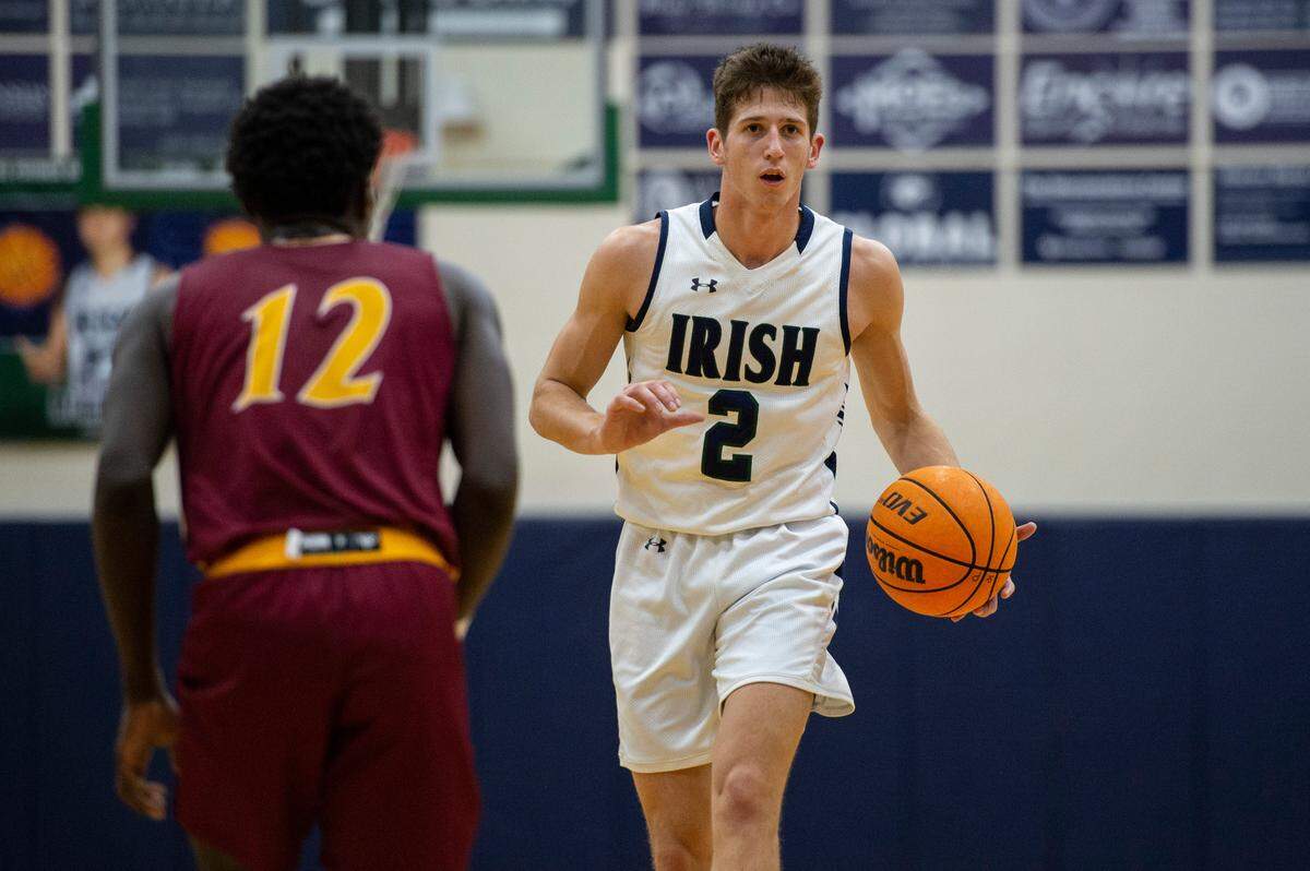 St. Patrick guard Nick Krass, right, faces down with Perry Central’s Cameron Rankins during a game against Perry Central at St. Patrick Catholic High School on Thursday, Jan. 13, 2022.