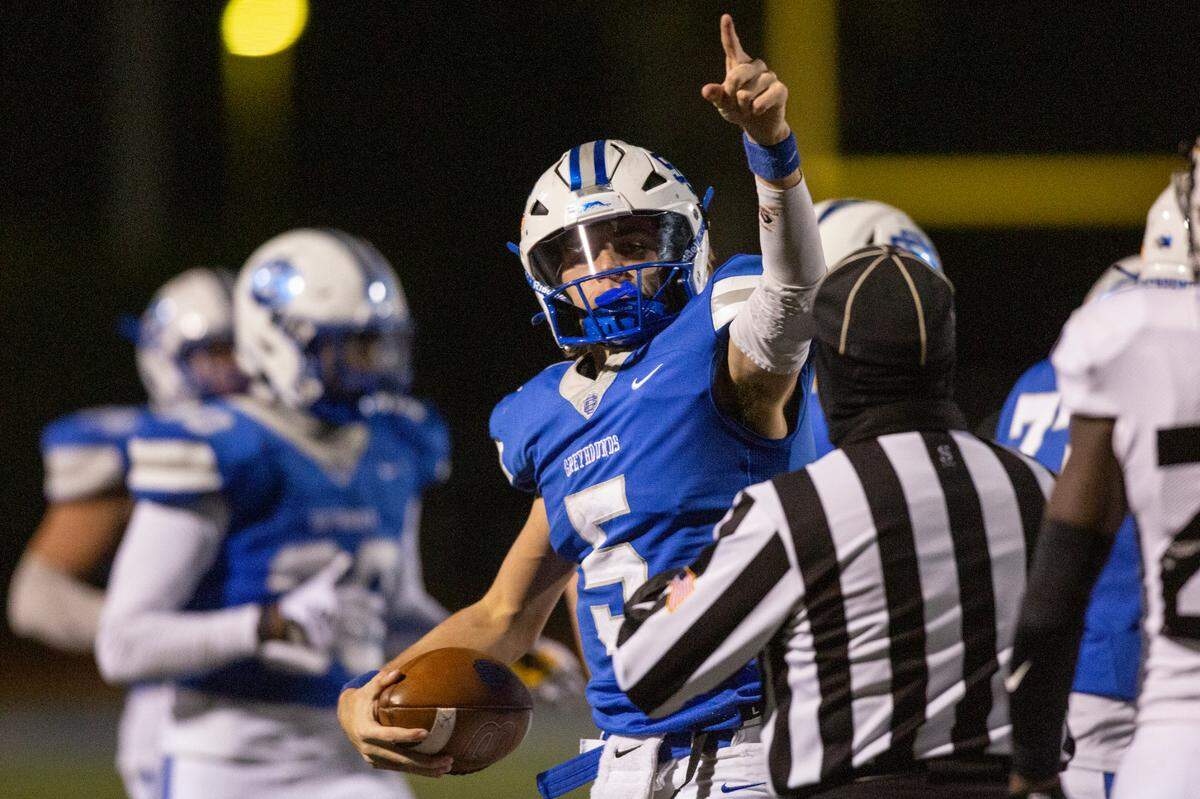 Ocean Springs’ quarterback Bray Hubbard celebrates after a play during a 6A playoff game at Greyhound Stadium in Ocean Springs on Friday, Nov. 18, 2022.