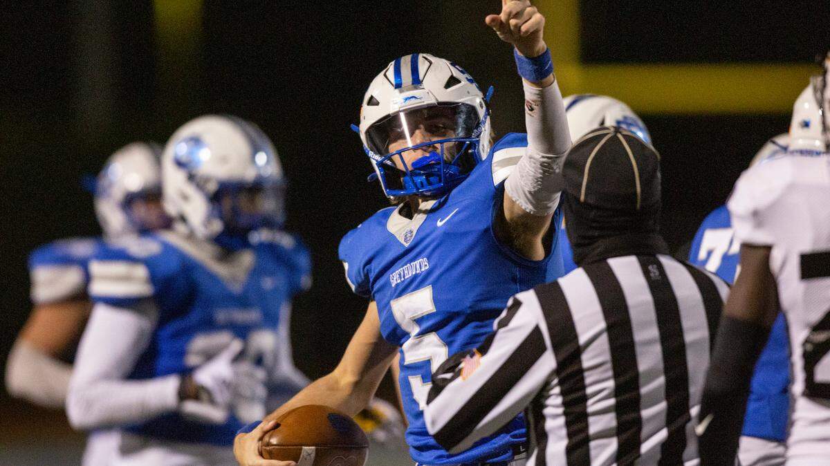 Ocean Springs’ quarterback Bray Hubbard celebrates after a play during a 6A playoff game at Greyhound Stadium in Ocean Springs on Friday, Nov. 18, 2022.