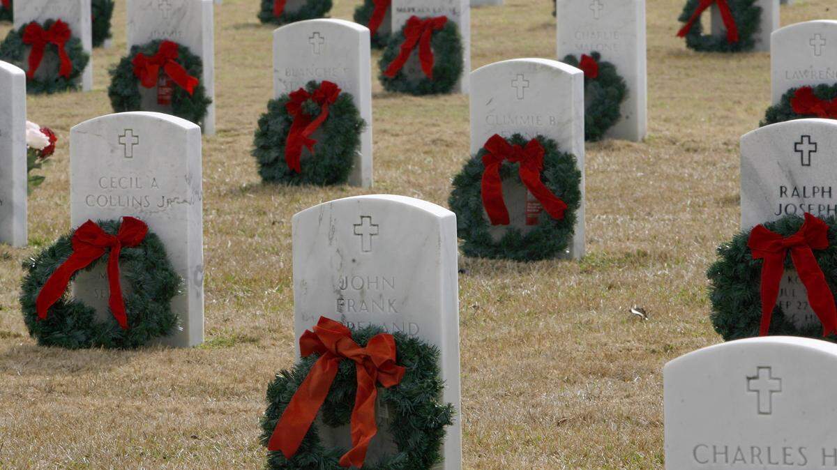 TIM ISBELL/SUN HERALD 
 Approximately 4,000 wreaths were placed on some of the 19,000 graves at the Biloxi National Cemetery, Saturday, Dec. 6, 2014. It is the second year for this ceremony. Organizers hope to eventually have a wreath for every grave.