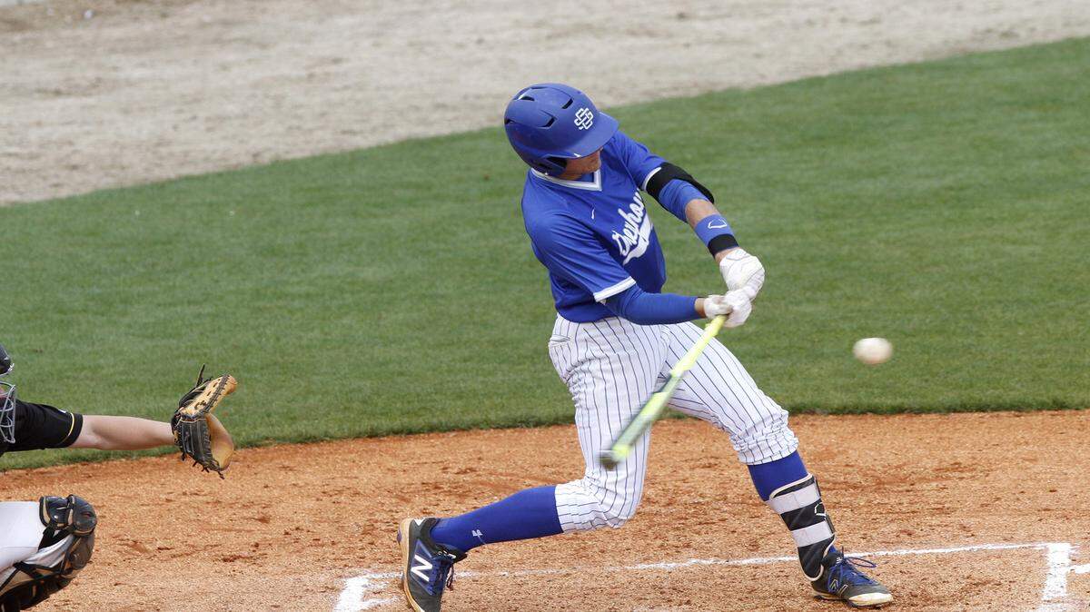 TIM ISBELL/SUN HERALD 
 Ocean Springs third baseman Drew Windham knocked in four runs to lead the Greyhounds to a victory over Oak Grove, Saturday, March 26, 2016.