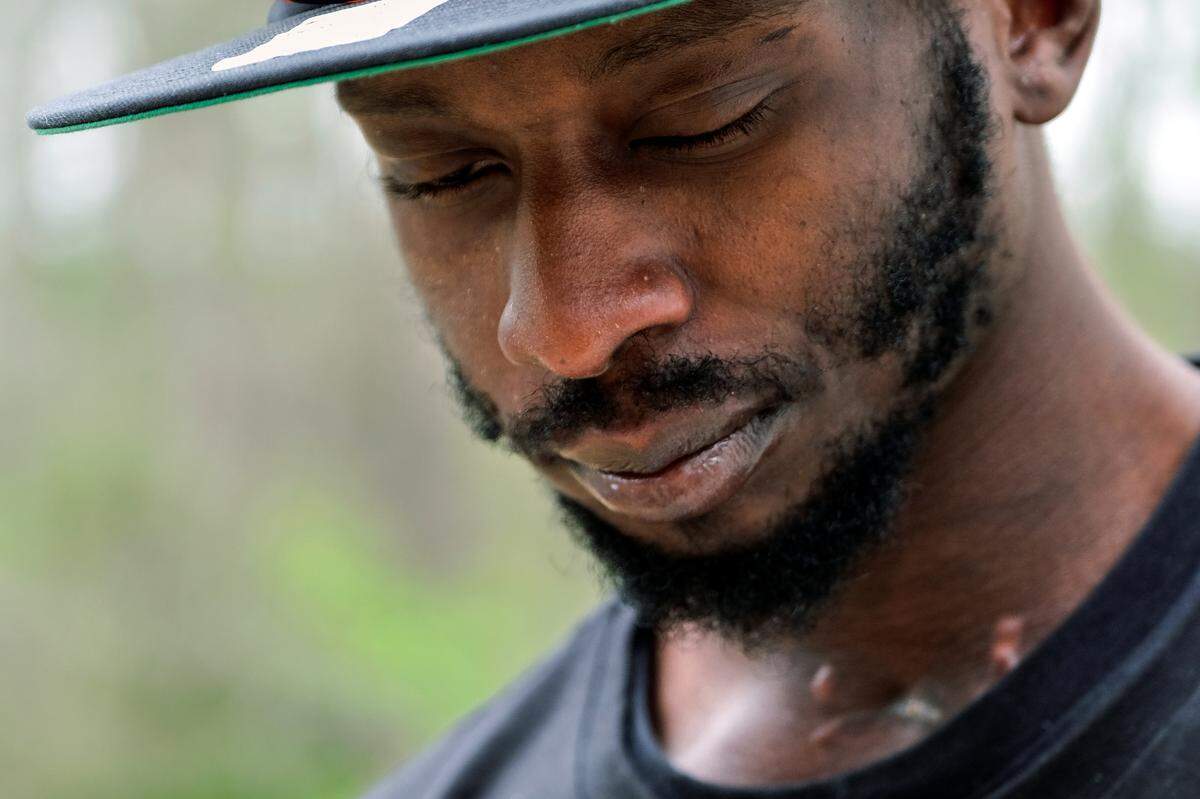 Michael Corey Jenkins stands outside Taylor Hill Church in Braxton, Miss., March 18, 2023. Six former law enforcement officers in Mississippi have been charged with federal civil rights offenses against two Black men who were brutalized for more than an hour during a home raid before an officer allegedly shot one of the men in the mouth. The charges were unsealed Thursday, Aug. 3, 2023, as the former officers, all of whom are white, appeared in federal court. (AP Photo/HG Biggs, File)