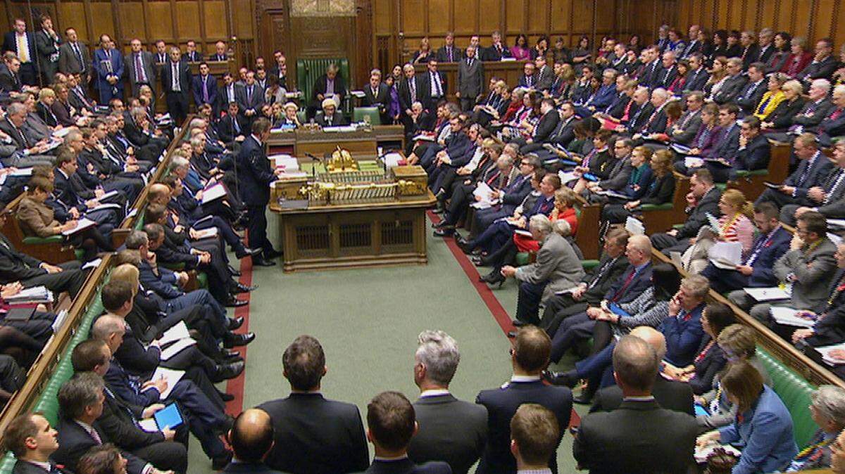 PARLIAMENTARY RECORDING UNIT VIA AP VIDEOBritish Prime Minister David Cameron, standing at left, talks to lawmakers in the House of Commons in London during a debate Dec. 2 on launching airstrikes against Islamic State extremists inside Syria. Hilary Benn, the shadow foreign secretary of the liberal Labour Party, gave a speech urging support for the strikes, saying, 'We must now confront this evil.'