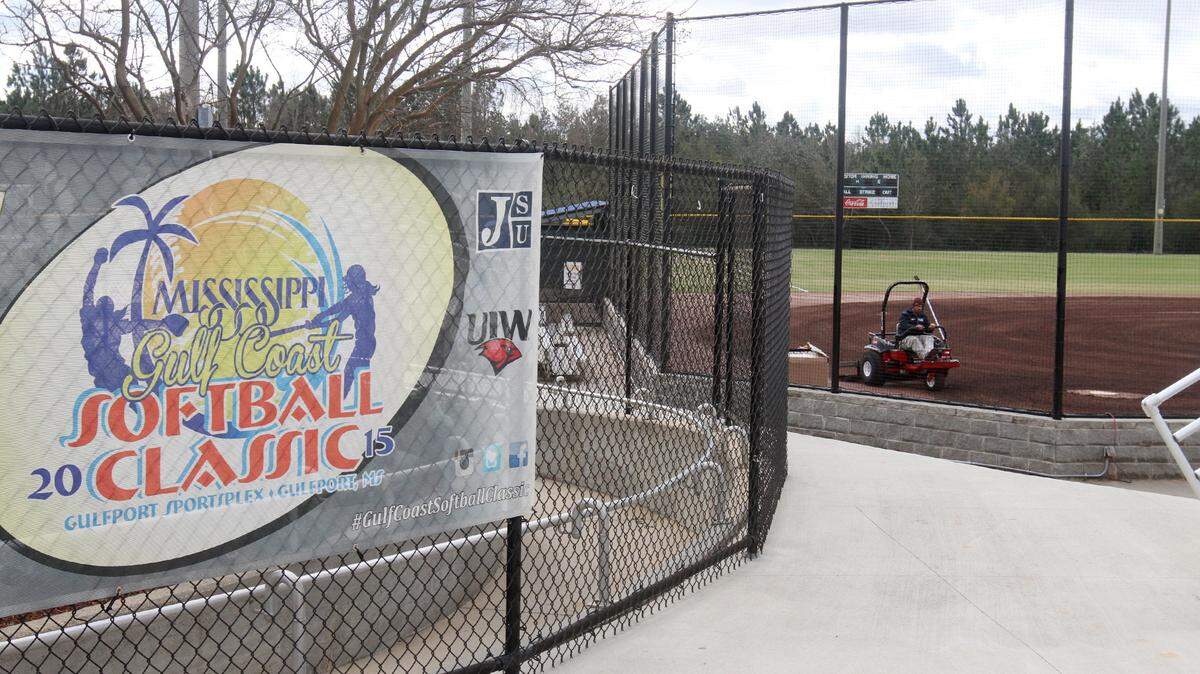 Doug Albritton grooms the infield dirt on one of the softball fields at the Gulfport Sportsplex on Wednesday in preparation for the Mississippi Gulf Coast Softball Classic.