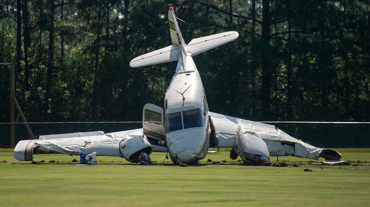 A small plane sits in a field behind the Ocean Springs Middle School in Ocean Springs on Friday, June 23, 2023, after crashing upon takeoff from the Ocean Springs Airport.