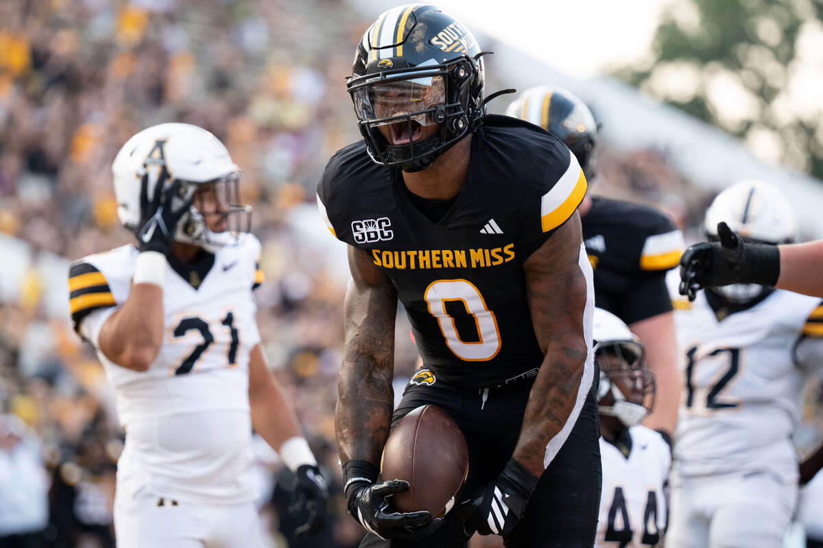 Southern Miss running back Jeffery Pittman (0) celebrates scoring a touchdown Saturday against App State.