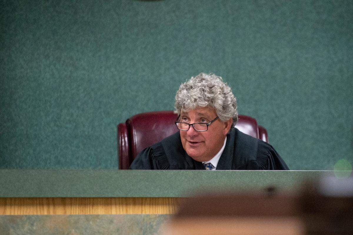 Judge Mark Watts presided over an initial appearance for Karis Hamilton and his mother, Monica Lynn Hall, in connection with a double shooting that left one dead and another seriously injured in Jackson County. 
