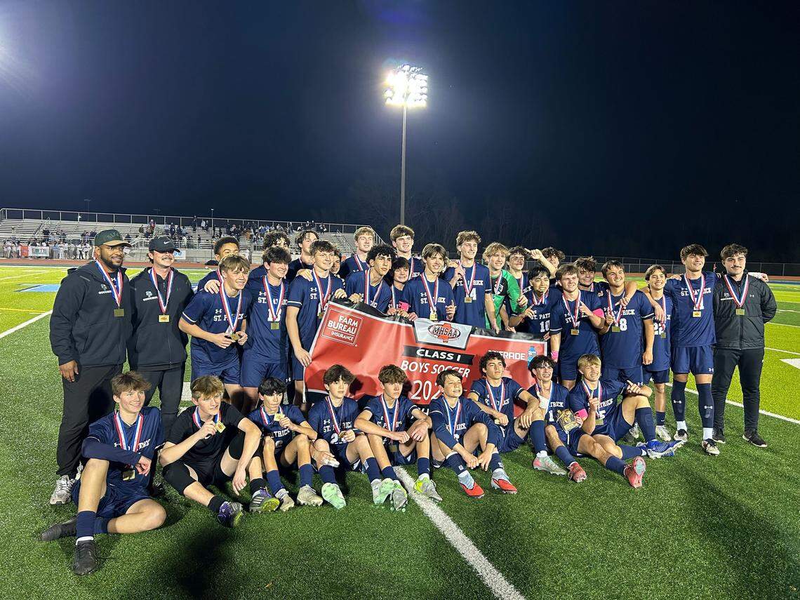 St. Patrick holds the banner up after winning the Class I state title on Feb. 20, 2026.