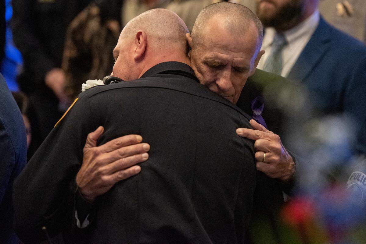 Family members of Steven Robin greet mourners during the funeral of Bay St. Louis police officers Sgt. Steven Robin and Branden Estorffe at the Bay St. Louis Community Center in Bay St. Louis on Wednesday, Dec. 21, 2022. Robin and Estorffe were killed responding to a call at a Motel 6 on Dec. 14.