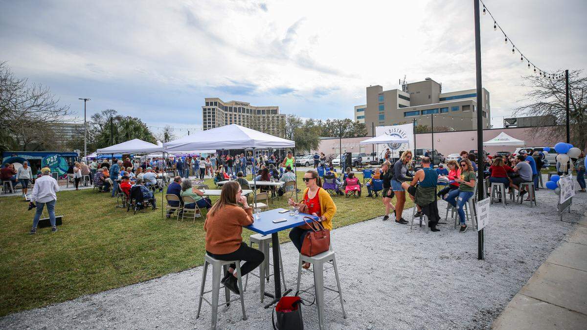People filled in seating across the District Green space to listen to music and enjoy food from local food trucks as a block party kicked off the space’s first official event downtown on Howard Avenue in Biloxi.