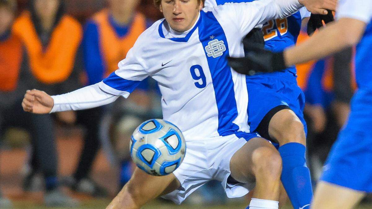 BOB SMITH/SPECIAL TO THE SUN HERALD 
 Ocean Springs Caleb Burke (9) controls the ball during the MHSAA Soccer State 6A Championship held in Clinton Saturday February 6th 2016. (For the Sun Herald/Bob Smith)