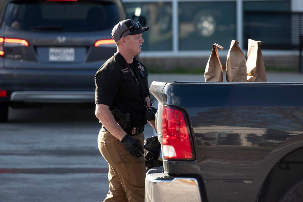 Law enforcement clear the scene of a shooting outside the Pearl River County Courthouse Annex in Poplarville on Tuesday, Dec. 17, 2024. James Ray Saucier, 62, of Poplarville, was shot outside the building.