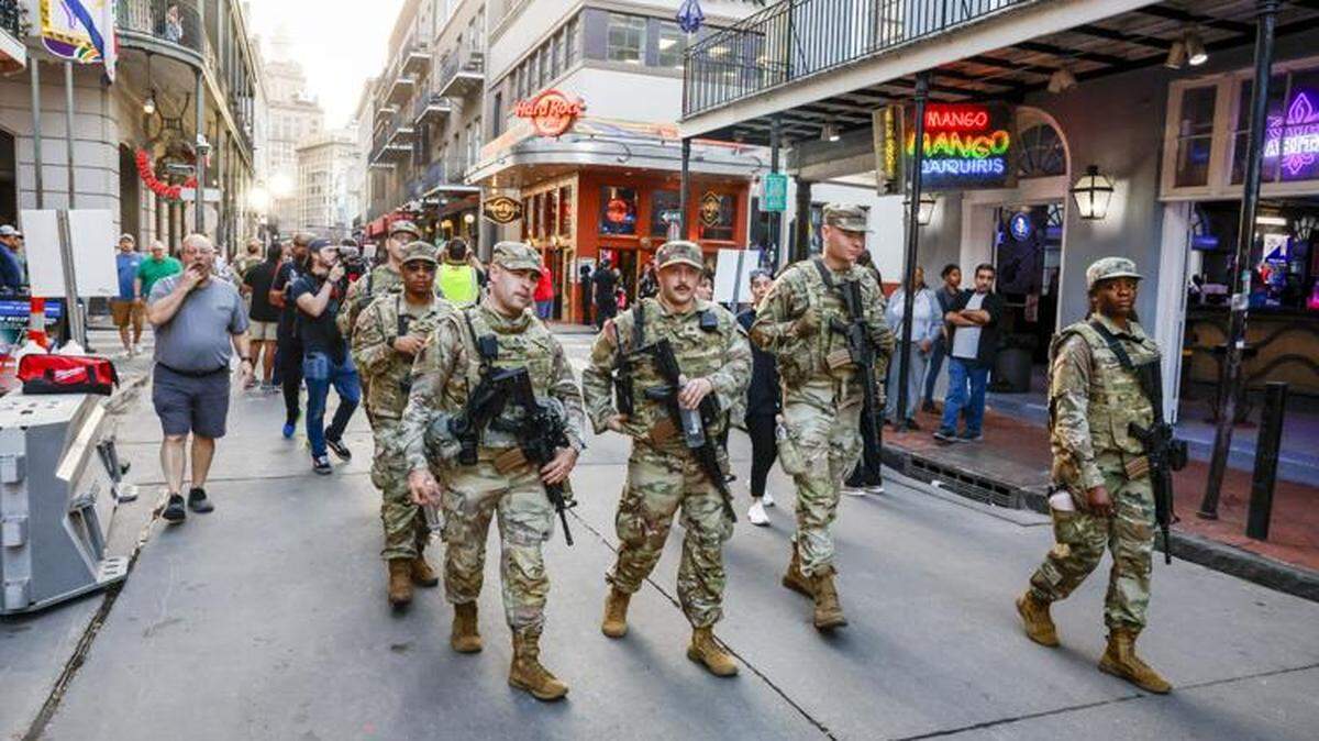 Soldiers with the Louisiana National Guard walk down Bourbon Street on Feb. 5, 2025.