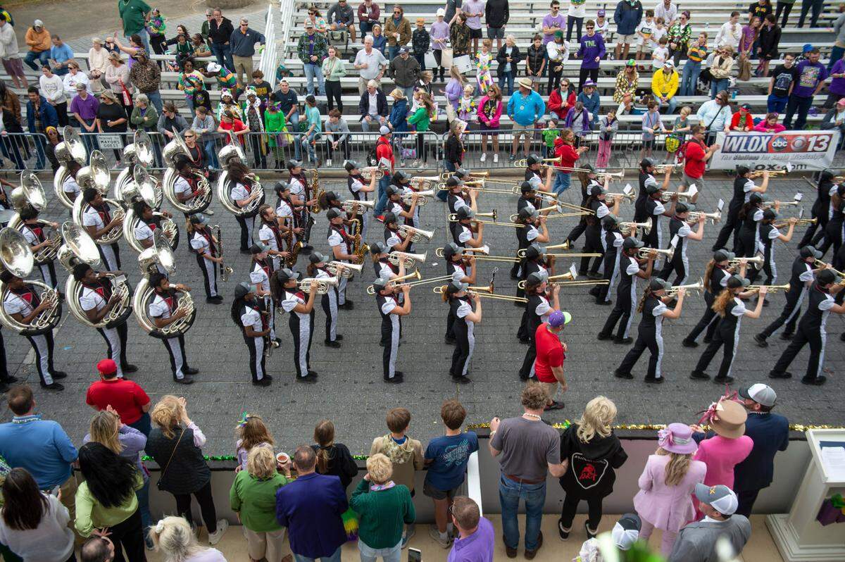 The Biloxi High School Marching Band marches in the Gulf Coast Carnival Association Mardi Gras parade in Biloxi on Tuesday, March 4, 2025.