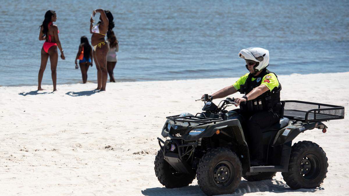 A Biloxi police officer patrols Biloxi Beach during Black Spring Break on Saturday, April 12, 2025.