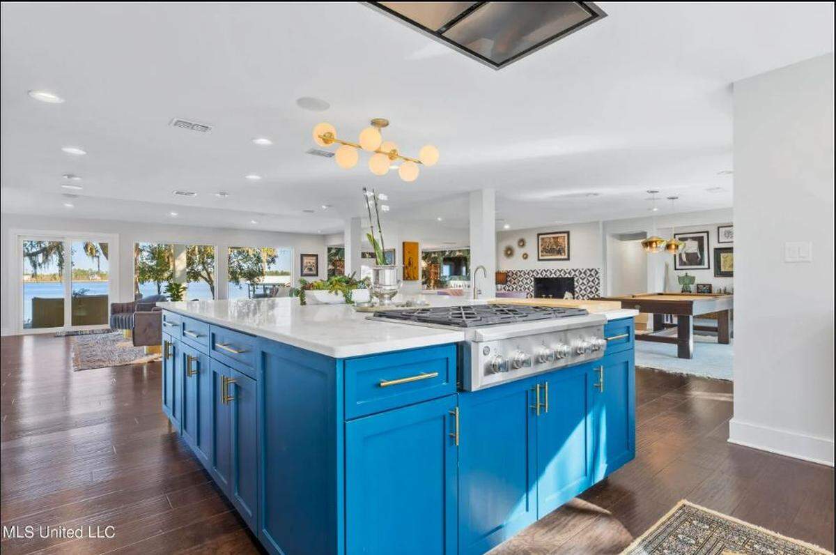 Blue cabinets, stainless steel appliances and water views are features of the Biloxi home.