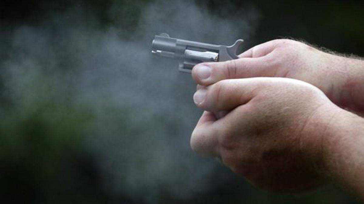 ROGELIO V. SOLIS/ASSOCIATED PRESSJohn Windsor, a veteran police officer and instructor at Gun Guy Tactical, shows the proper hold technique as he fires a participant's derringer revolver during the live fire portion of an enhanced concealed carry class sponsored by Crestview Baptist Church for members and area residents in Petal.