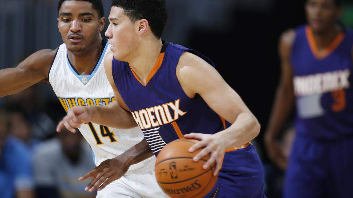 DAVID ZALUBOWSKI/ASSOCIATED PRESSPhoenix guard Devin Booker, of Moss Point, will be with the Suns tonight in the regular-season opener against Dallas.