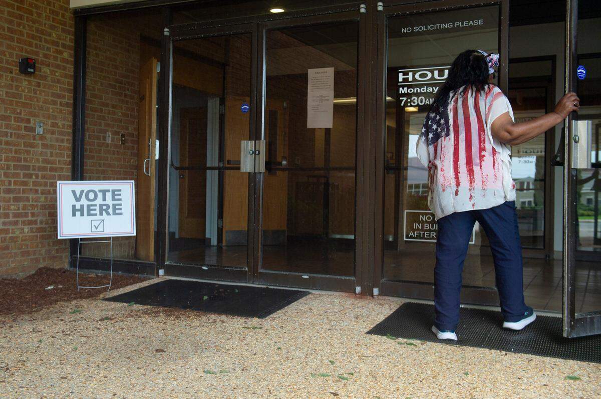 A voter enters a voting precinct at Dr. Martin Luther King Jr. Municipal Building in Biloxi on Tuesday, April 1, 2025.