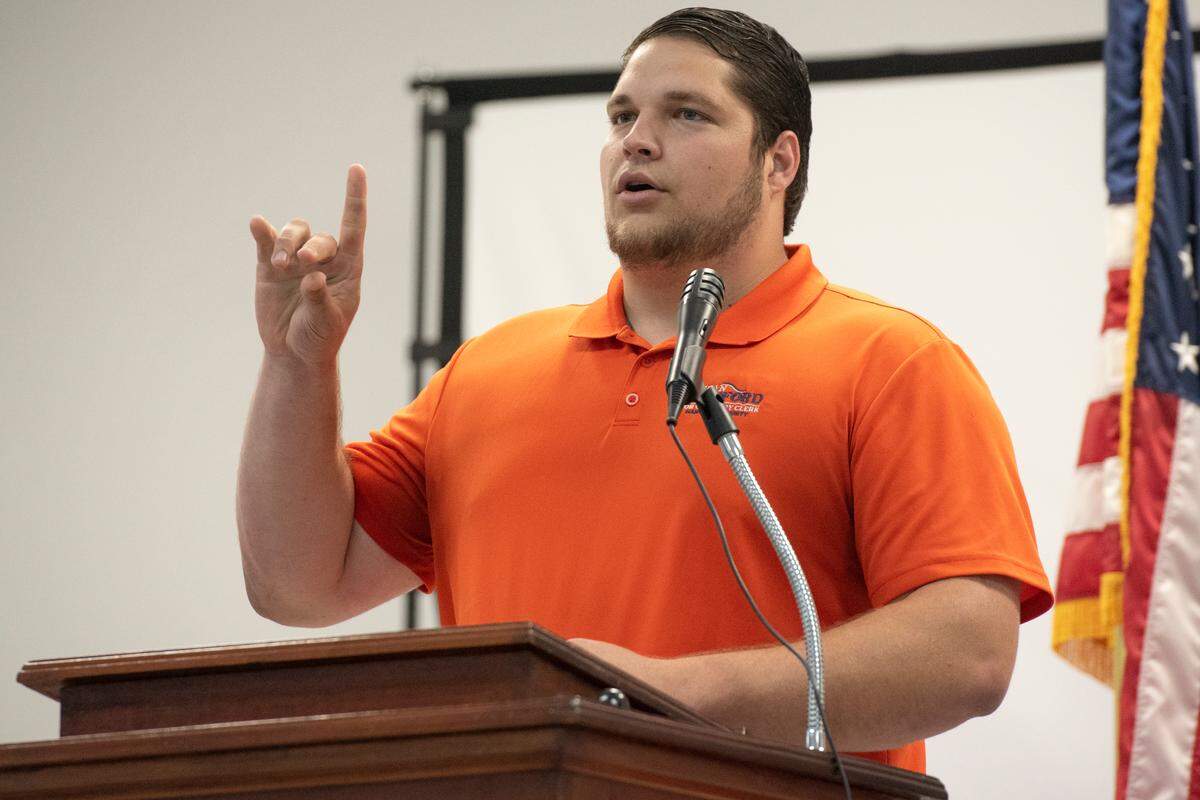 Jordan Bradford, a candidate for chancery clerk in Hancock County, uses sign language during an election forum in Waveland on Monday, July 10, 2023.