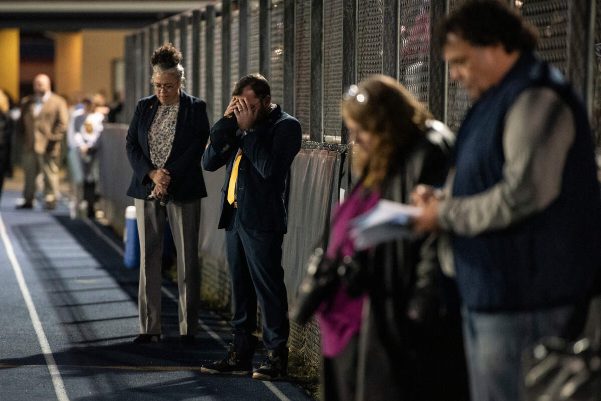 Staff of the Pascagoula-Gautier School District react during a candlelight vigil in honor of three Gautier High School graduates at Gautier High School in Gautier on Thursday, Dec. 7, 2023. Se’Dhari Saniya Watson-Person, Kyla “Muffin” Watkins, and Tatyanna Richmond were involved in a fatal crash on Tuesday, leading to the deaths of Watson-Person and Watkins. Richmond remains hospitalized.