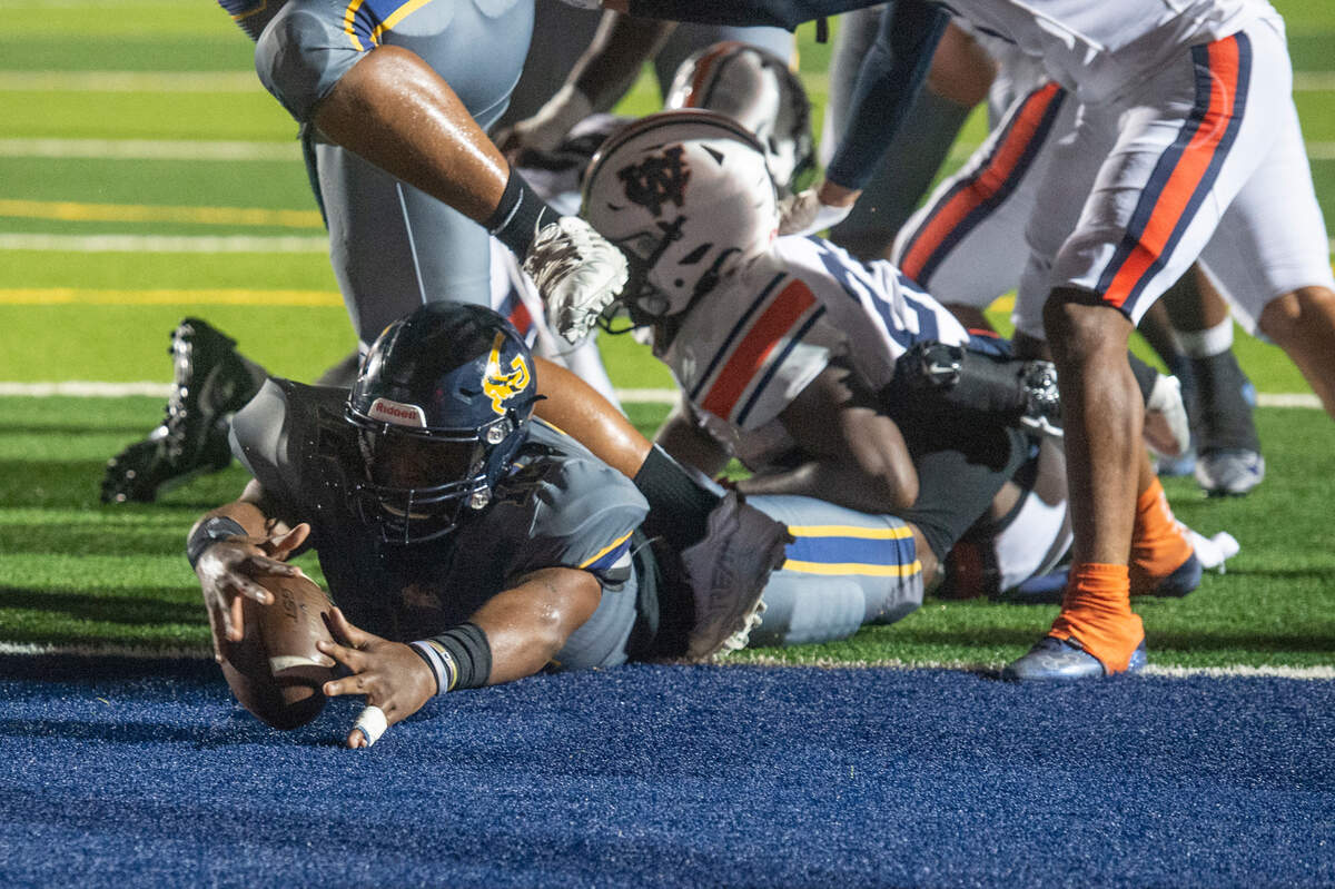Gautier’s Kaden Irving puts the ball into the end zone for a touchdown during a playoff game against Wayne County at Gautier High School in Gautier on Friday, Nov. 11, 2022.