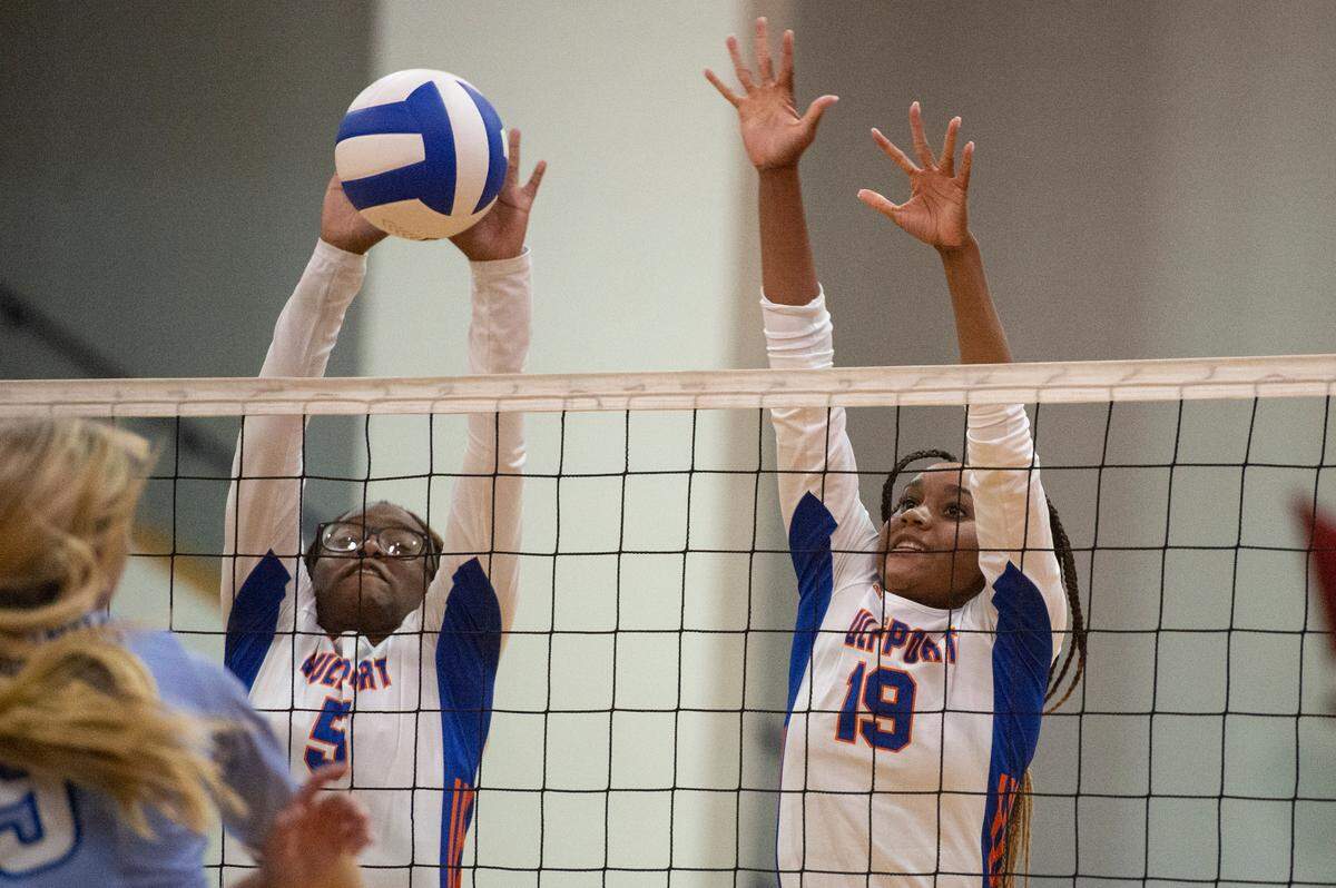 Gulfport’s Jhaida McDuffie, right, and Amiya Ware block a spike from Ocean Springs during a volleyball match against Ocean Springs at Gulfport High School in Gulfport on Tuesday, Oct. 4, 2022.
