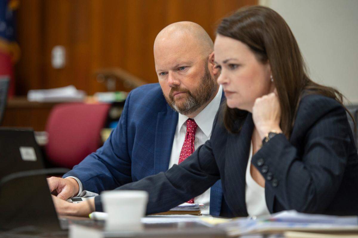 Assistant district attorneys George Huffman, left, and Alison Baker look at notes during the defense’s redirect during the trial of Cliff Kirkland in Harrison County Circuit Court in Biloxi on Tuesday, May 17, 2022.