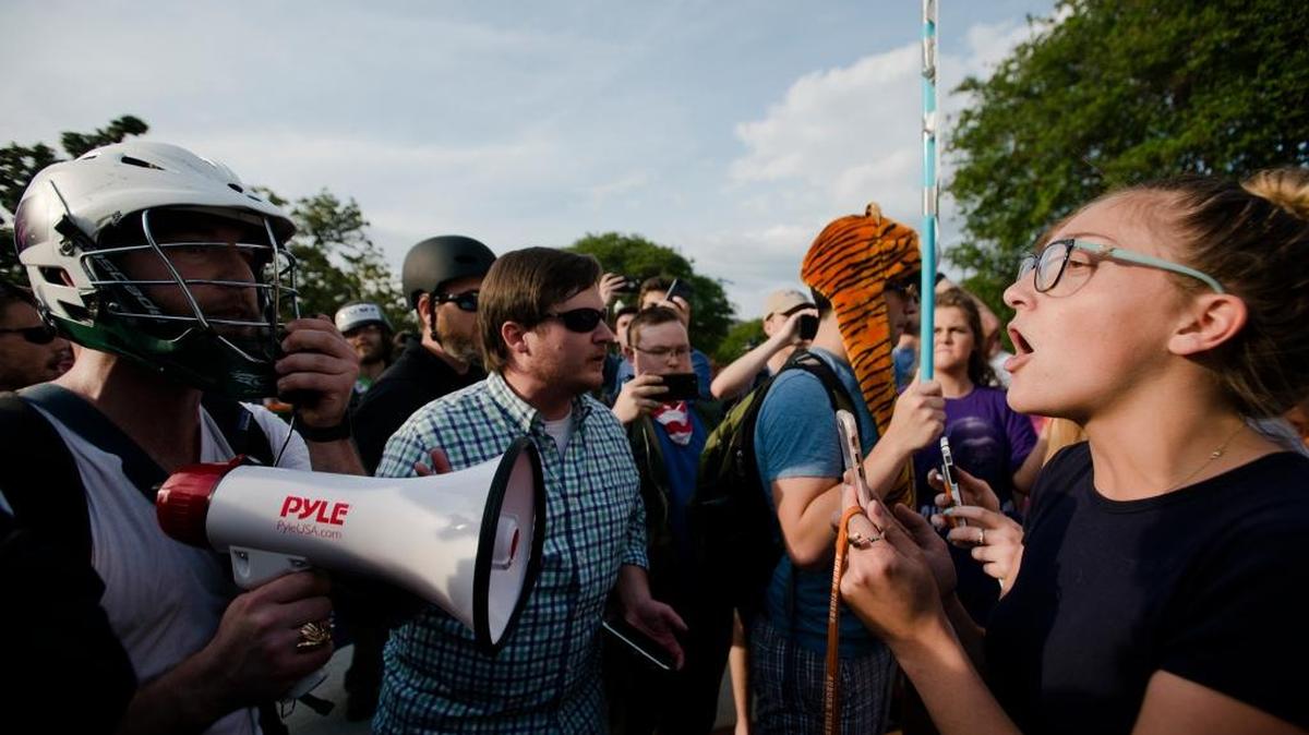 Kimberly Costen, Auburn freshman, right, yells at supporters of Richard Spencer’s right to speak at Auburn (Ala.) University on Tuesday, April 18, 2017. The man who rented Foy Hall for Spencer and was denied, filed a law suit and was granted an injunction by a federal judge to allow Spencer to speak.