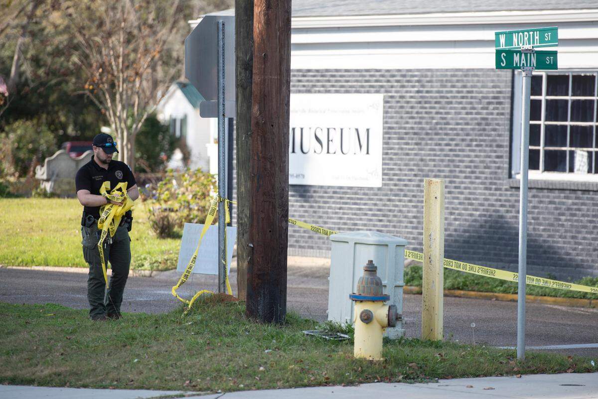 Law enforcement clear the scene of a shooting outside the Pearl River County Courthouse Annex in Poplarville on Tuesday, Dec. 17, 2024. James Ray Saucier, 62, of Poplarville, was shot outside the building.