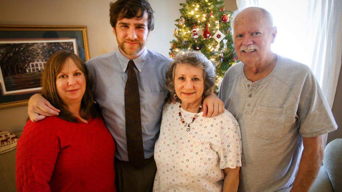 AMANDA McCOY/SUN HERALD'Scuba Steve' Johnson, second from left, stands with his mother, Karen Johnson, left, and grandparents Lois and Joe Sanders on Christmas Day in Gulfport. Scuba Steve said a CT scan done Monday shows he is responding well to radiation therapy to treat his colorectal cancer. He is also healing and feeling better from the side effects of the treatment, which caused much of his body to burn and blister.