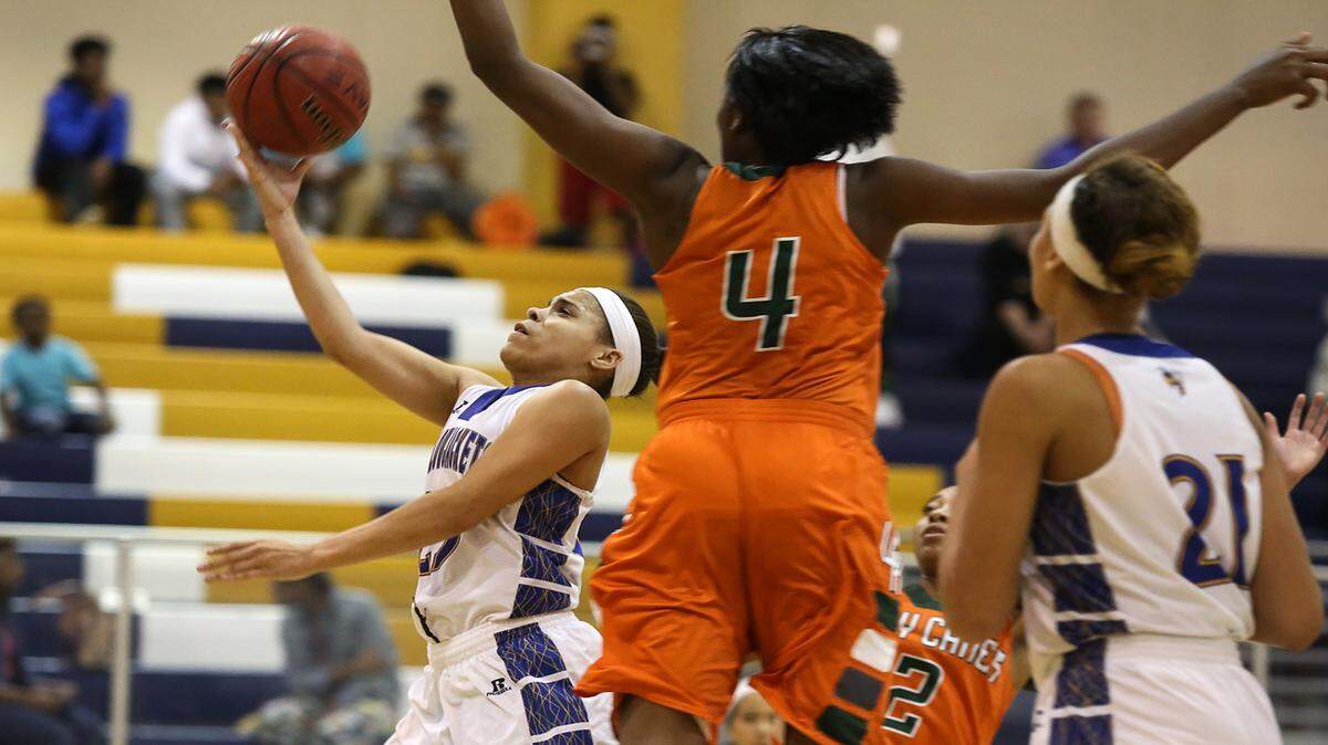 AMANDA McCOY/SUN HERALD 
 St. Martin's Deona Morgan breaks through the West Harrison defense while driving to the basket on Tuesday, December 8, 2015, at St. Martin High. St. Martin defeated West Harrison, 64-41.