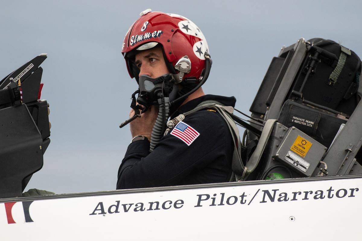 Advance Pilot and Narrator Maj. Jeff Downie puts on his helmet as he prepares a Thunderbird F-16 aircraft for flight at the Combat Readiness Training Center at Gulfport International Airport on Friday, Feb. 10, 2023. The Thunderbirds will return to the Mississippi Coast April 28 to April 30, 2023.