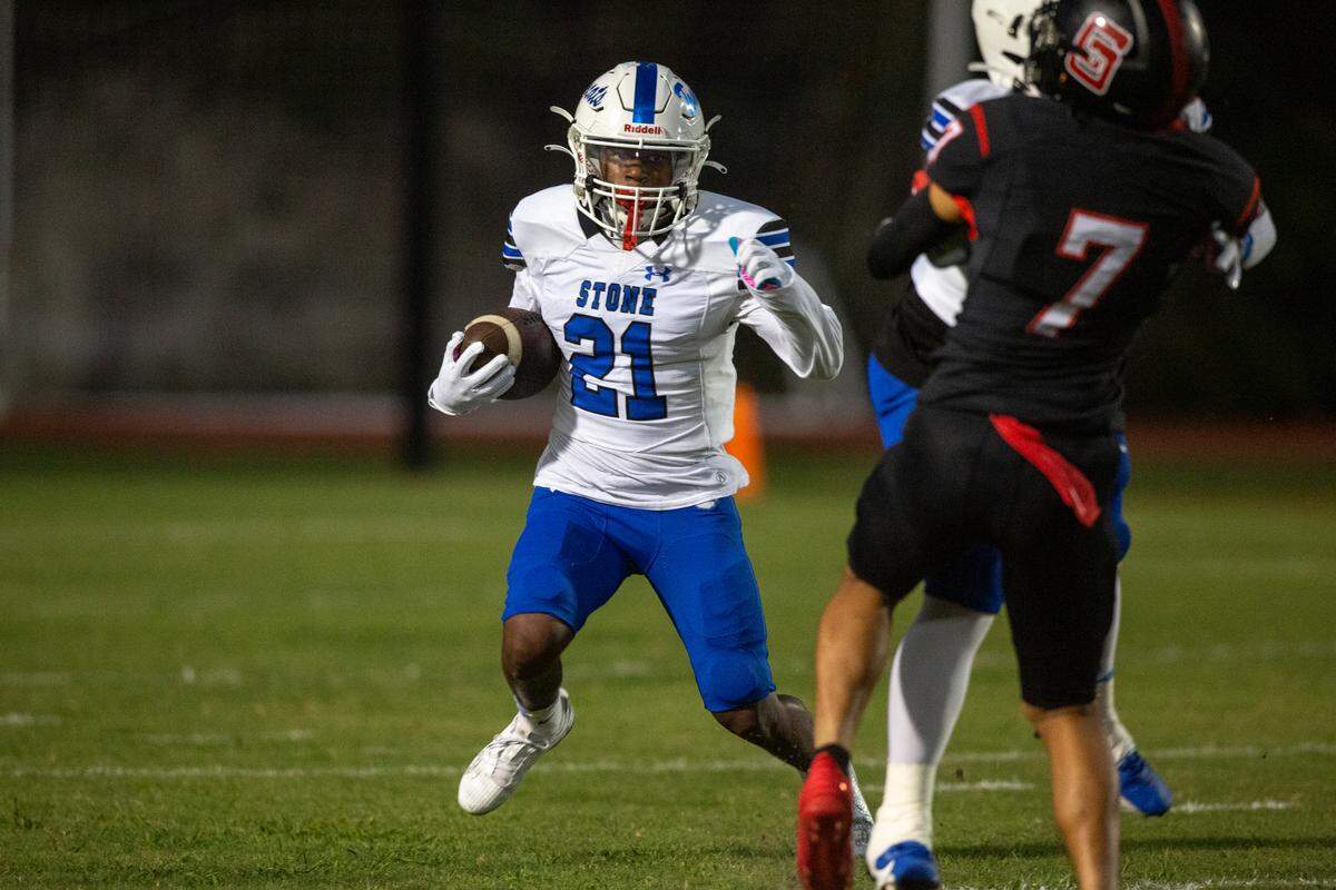 Stone’s Jayden Collins runs the ball down the field during a game against St. Stanislaus at St. Stanislaus High School in Bay St. Louis on Friday, Sept. 29, 2023.