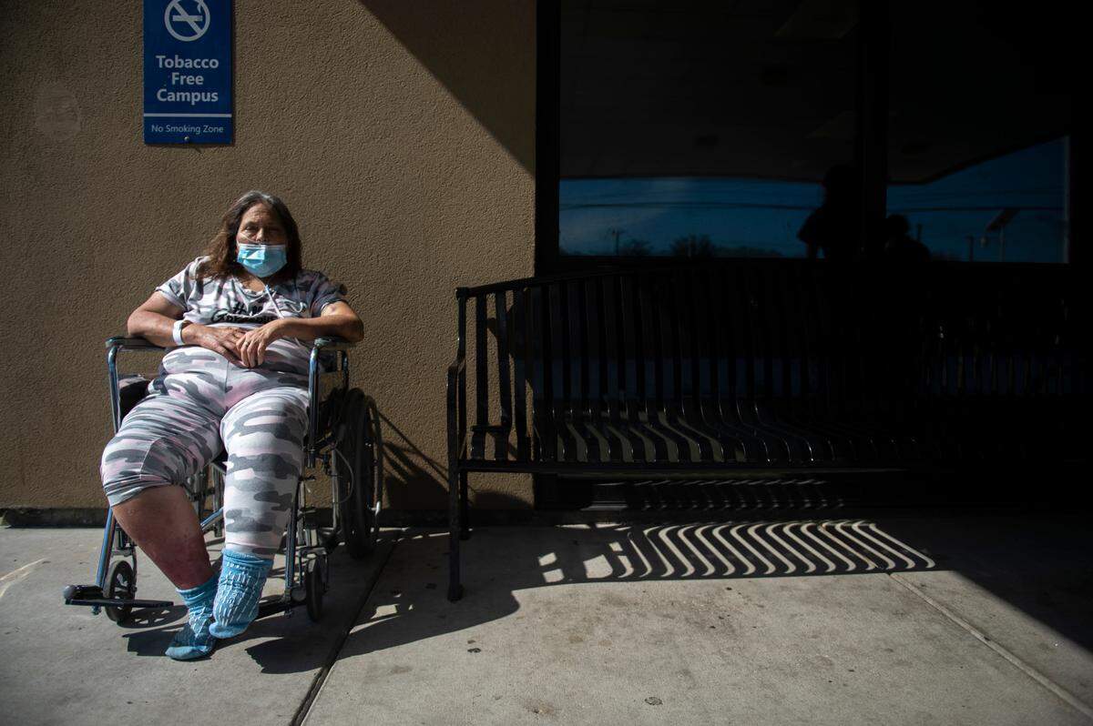 Carol Brennan, an Ocean Springs resident, waits to be admitted to the emergency room outside Ocean Springs Hospital, part of the Singing River Health System, on Tuesday, Aug. 17, 2021.