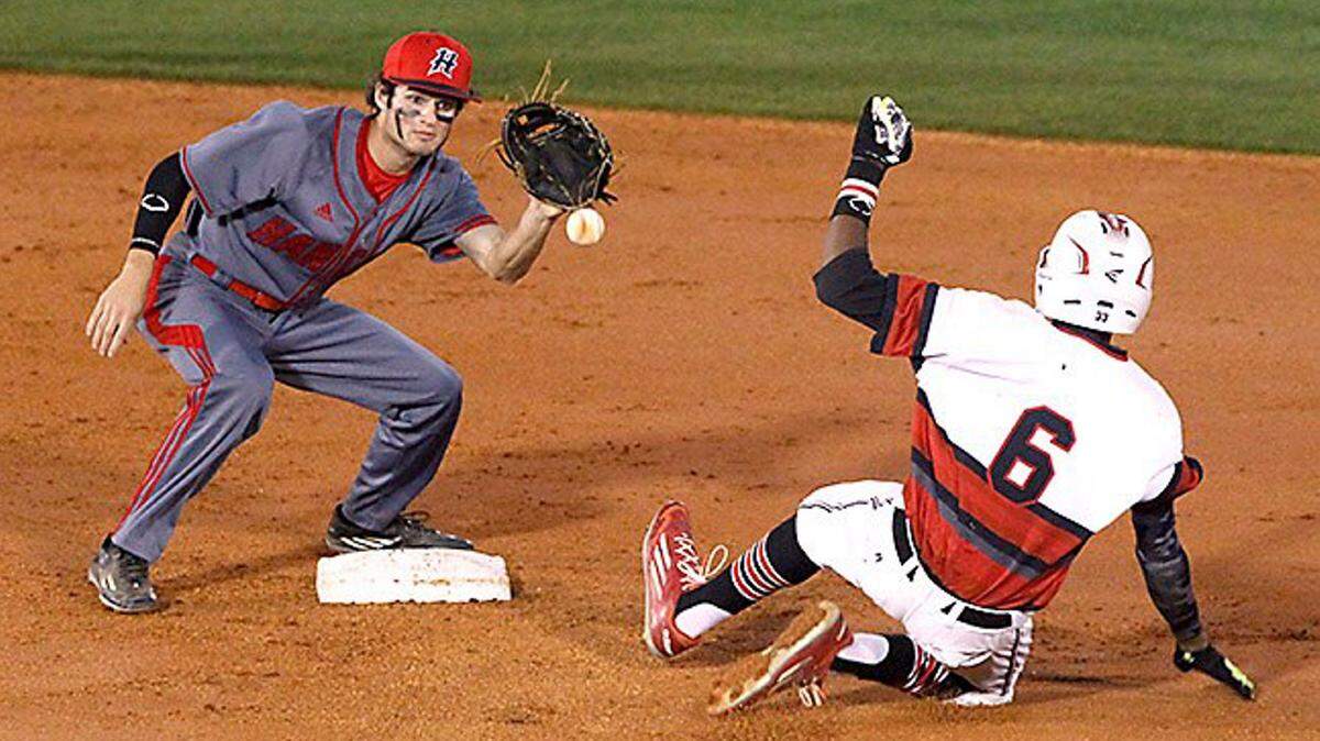 TIM ISBELL/SUN HERALD 
 Hancock's Brindon Hoda waits on the throw as Harrison Central's Brendan Hardy slides into second.