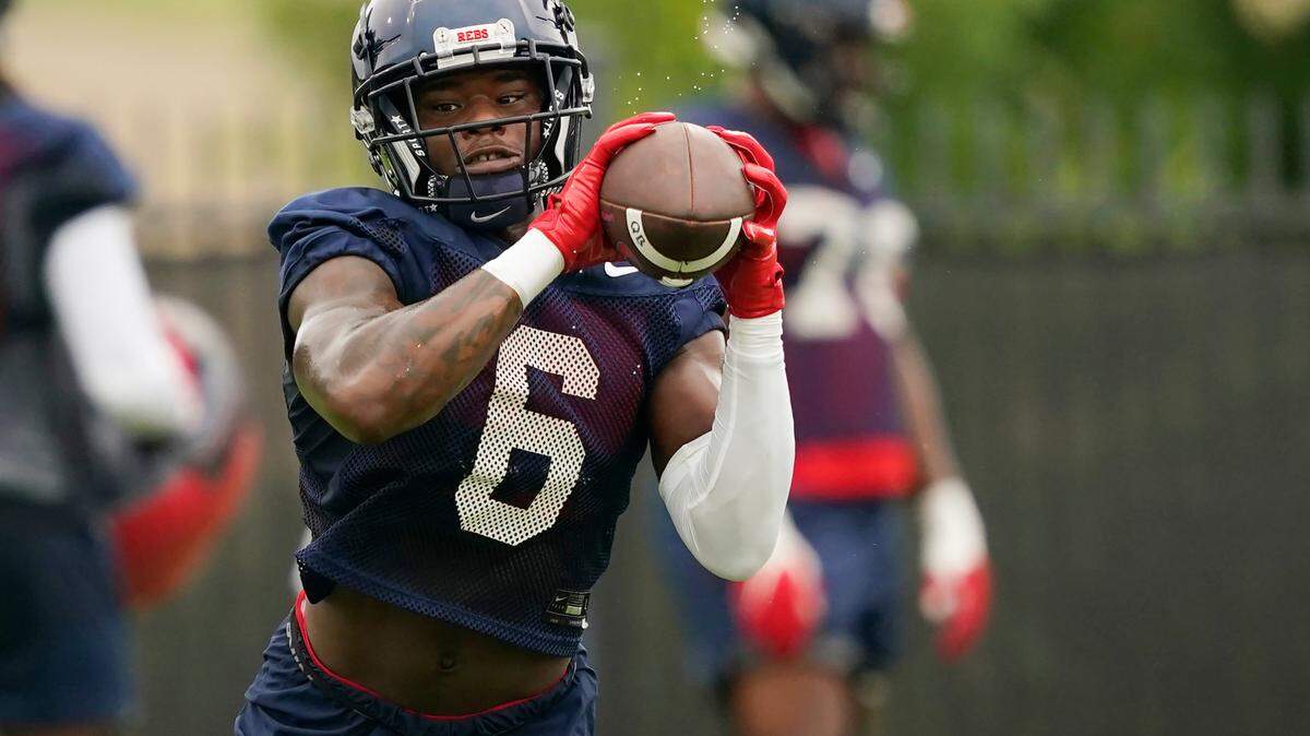 FILE - Mississippi running back Zach Evans (6) pulls in a pass during an NCAA college football practice on Aug. 3, 2022, in Oxford, Miss. Evans, a former five-star prospect, ran for 684 yards and five touchdowns in six games last season. (AP Photo/Rogelio V. Solis, File)