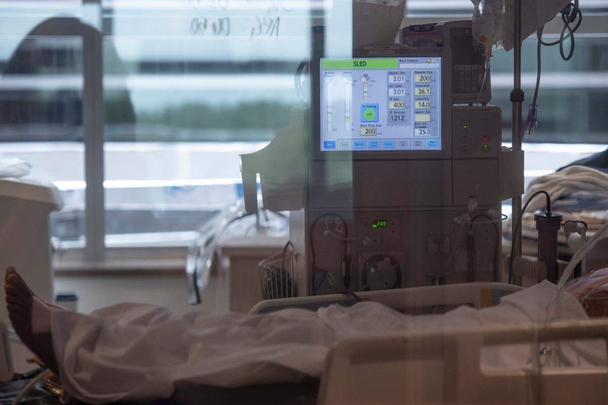 A COVID-19 patient in the ICU at Memorial Hospital in Gulfport on Wednesday, Aug. 11, 2021.