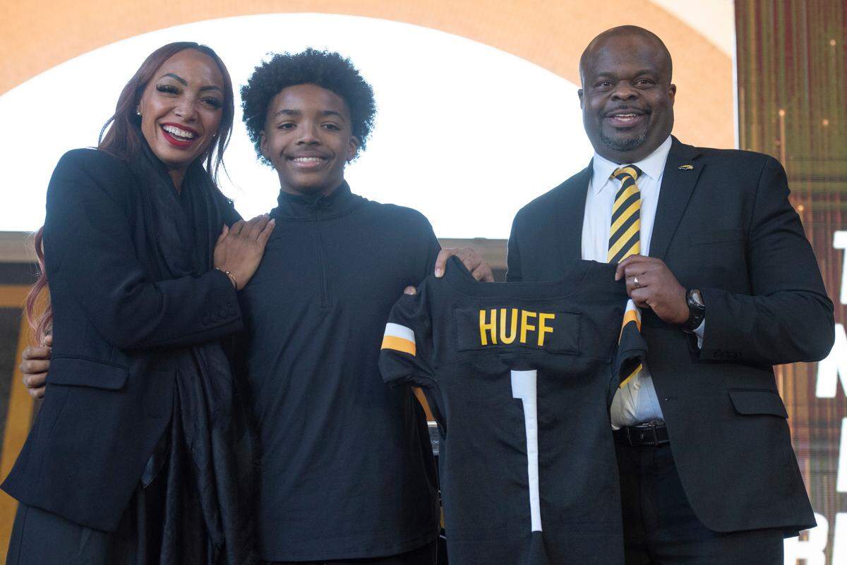 Southern Miss’ new head football coach Charles Huff poses with his family during a public welcome celebration for Huff at The Rock in Hattiesburg on Thursday, Dec. 12, 2024.